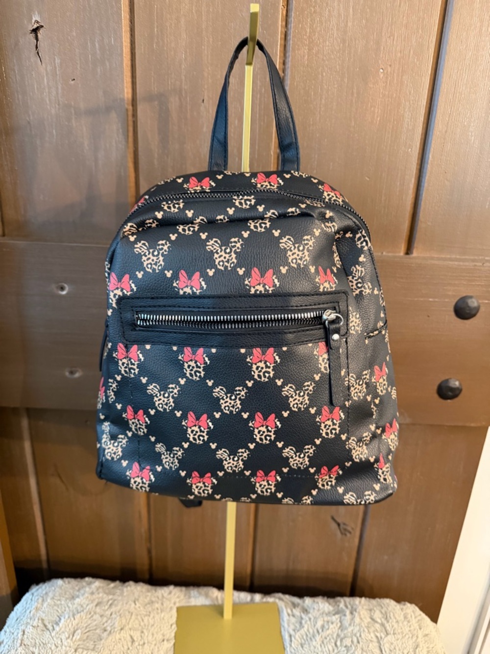 Disney Minnie Backpack with leopard print and red bows.  Small and lightweight